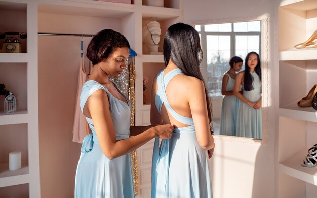 Bridesmaids fitting dresses