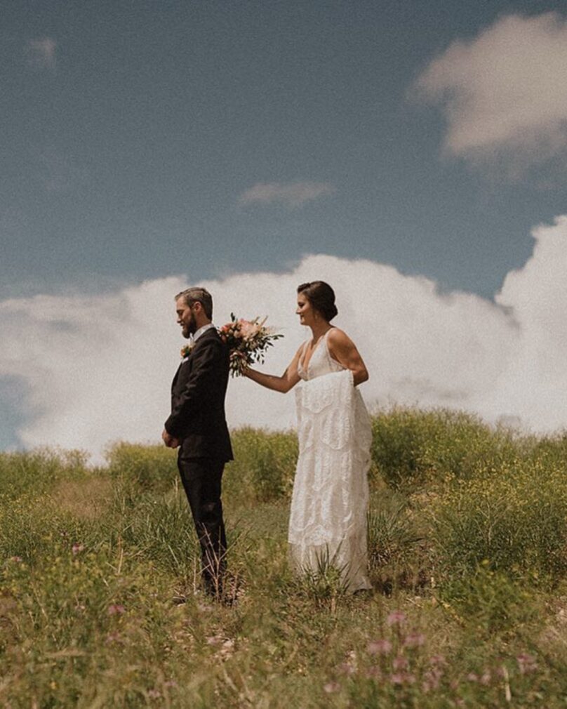 bride and groom in the field