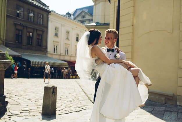 Happy Newlyweds are Taking Photos in the Square