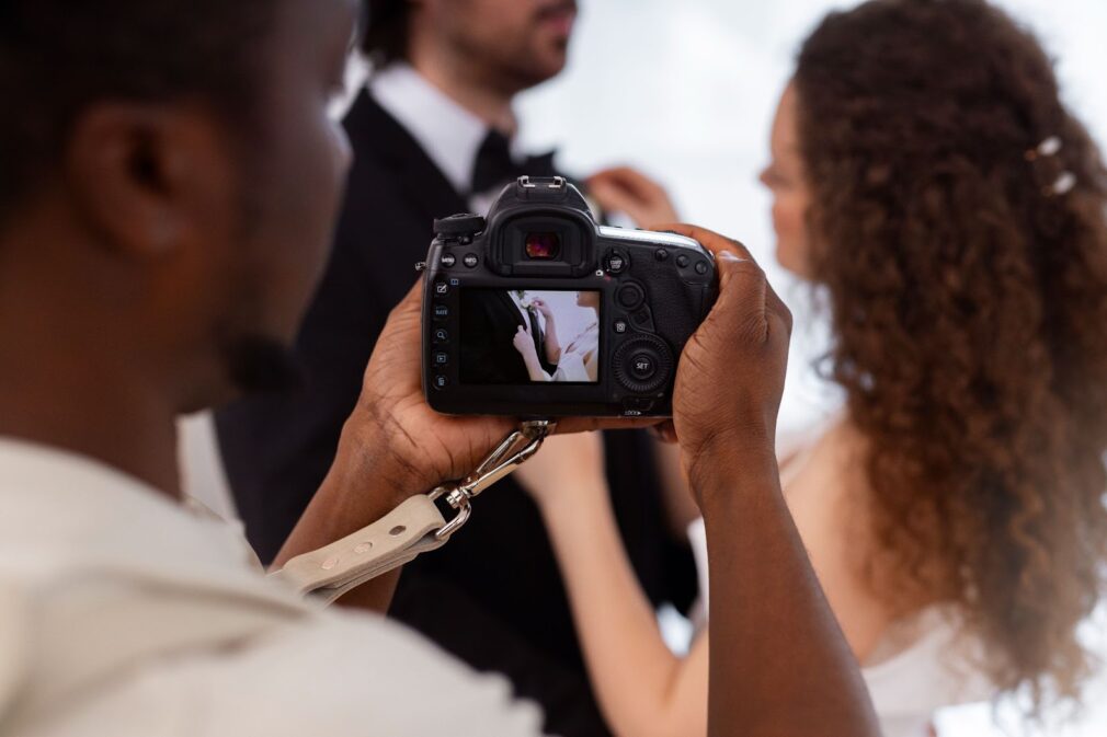 Side view of photographer taking wedding photos