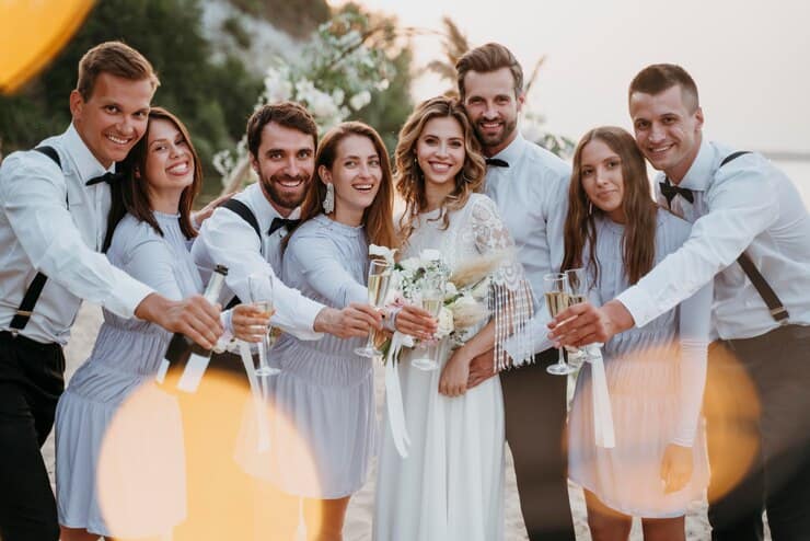 Wedding Сouple  with Friends on the Beach